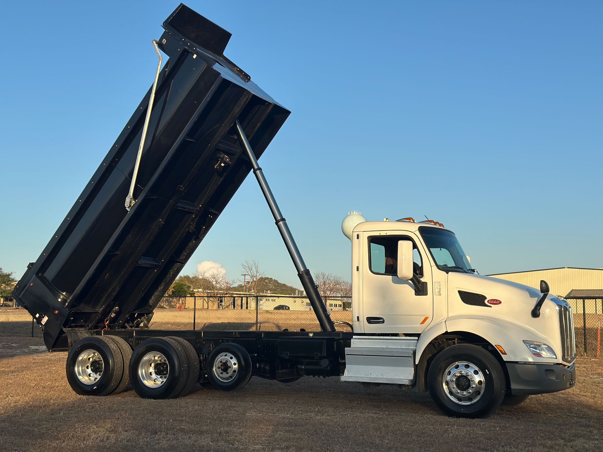 2022 Peterbilt 579 8x4 Tri- Axle Dump Truck 18' Dump Bed w/tarp system