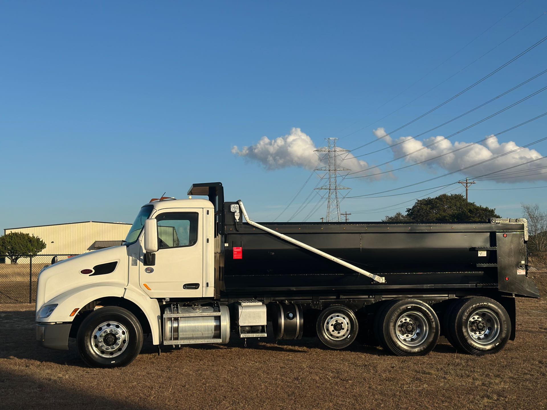 2022 Peterbilt 579 8x4 Tri- Axle Dump Truck 18' Dump Bed w/tarp system