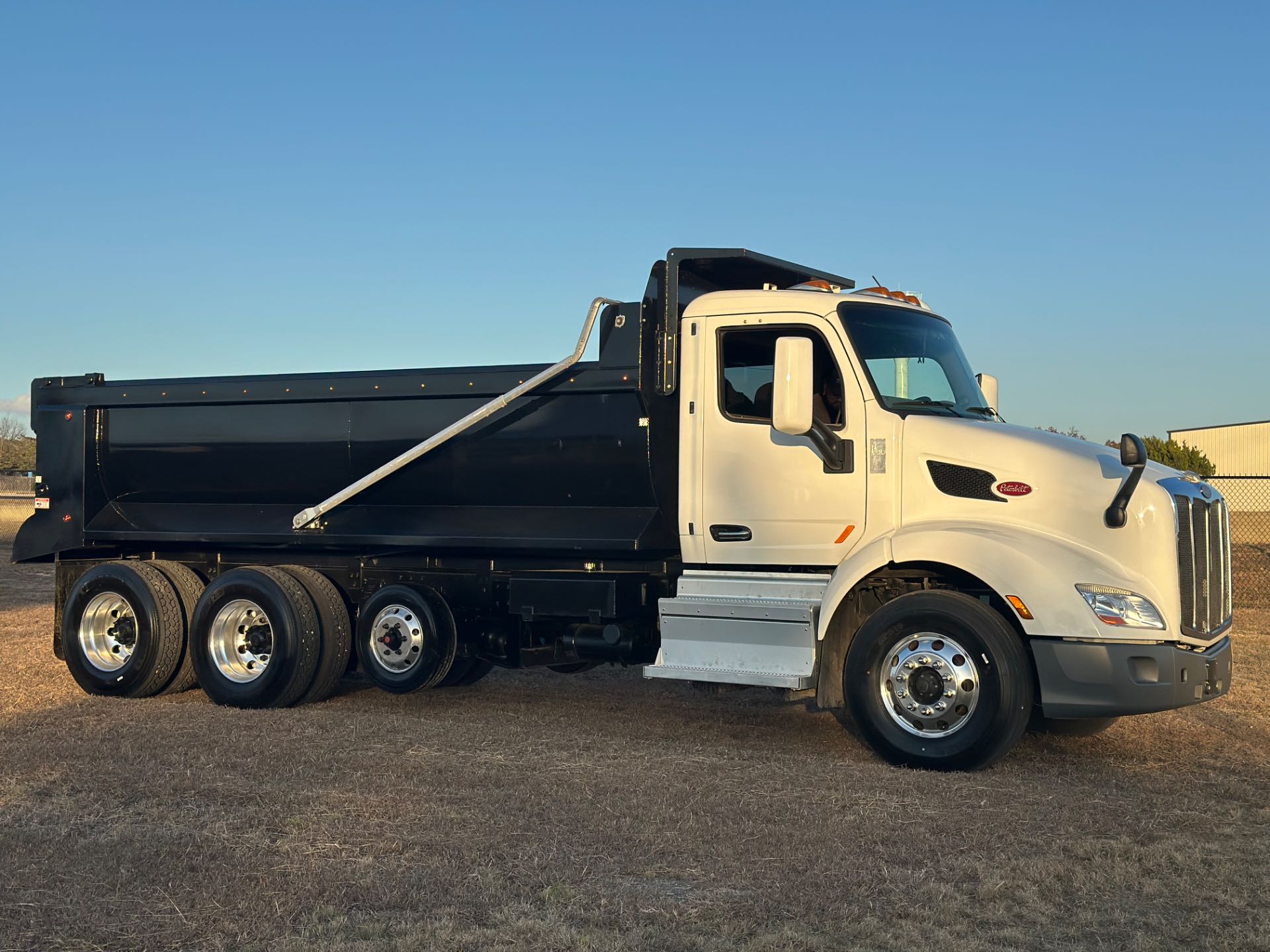 2022 Peterbilt 579 8x4 Tri- Axle Dump Truck 18' Dump Bed w/tarp system