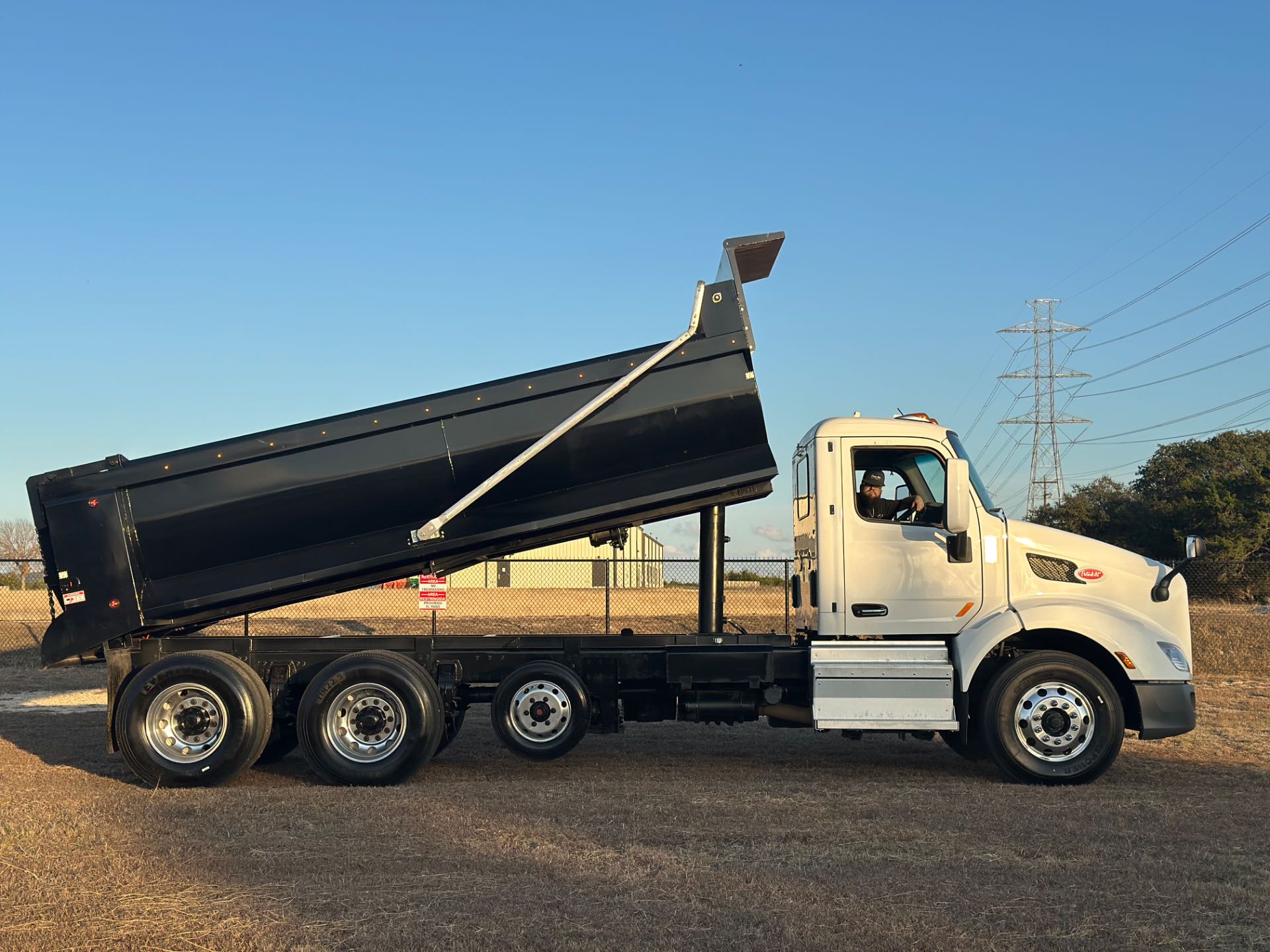 2022 Peterbilt 579 8x4 Tri- Axle Dump Truck 18' Dump Bed w/tarp system