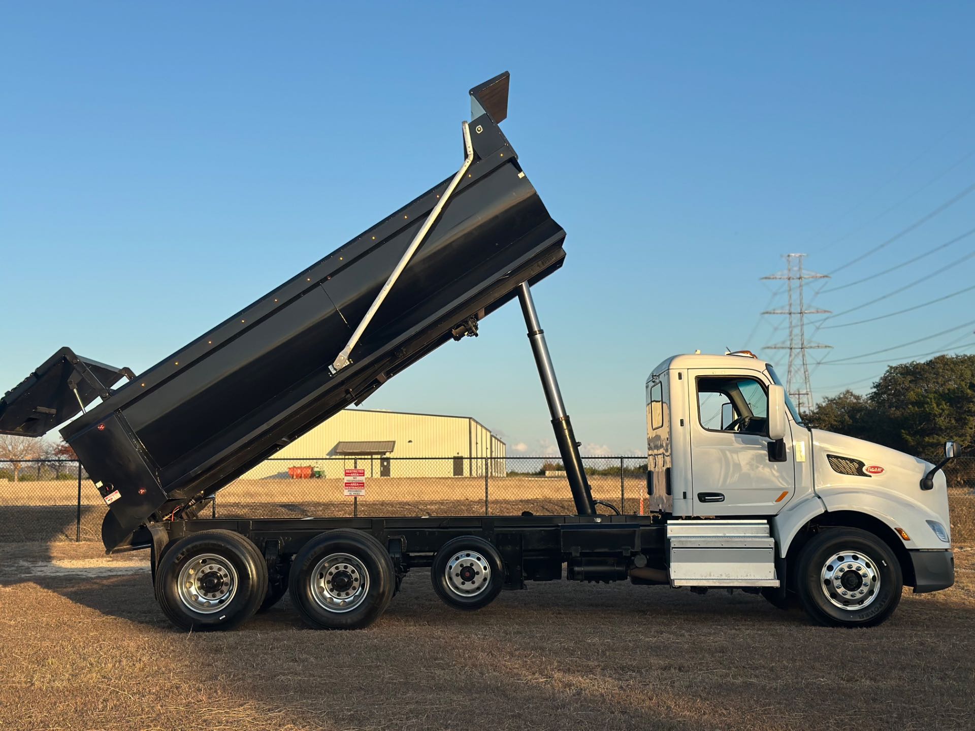 2022 Peterbilt 579 8x4 Tri- Axle Dump Truck 18' Dump Bed w/tarp system