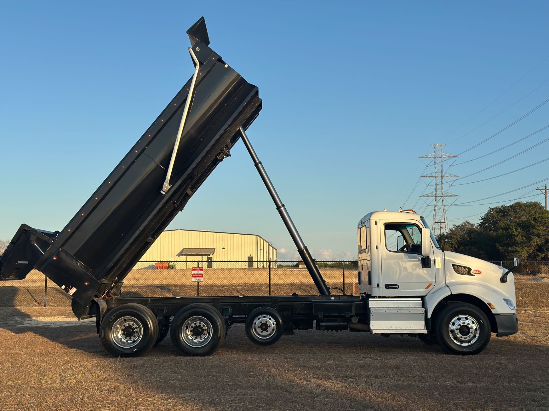 2022 Peterbilt 579 8x4 Tri- Axle Dump Truck 18' Dump Bed w/tarp system