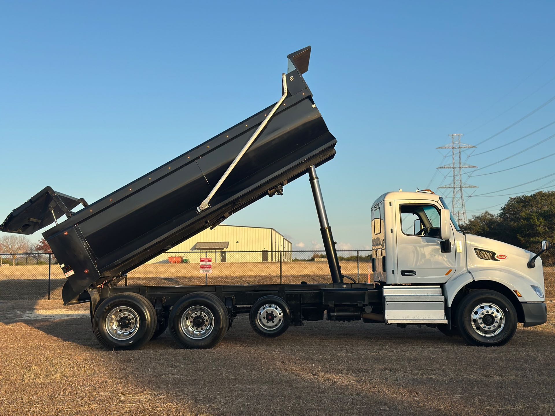 2022 Peterbilt 579 8x4 Tri- Axle Dump Truck 18' Dump Bed w/tarp system