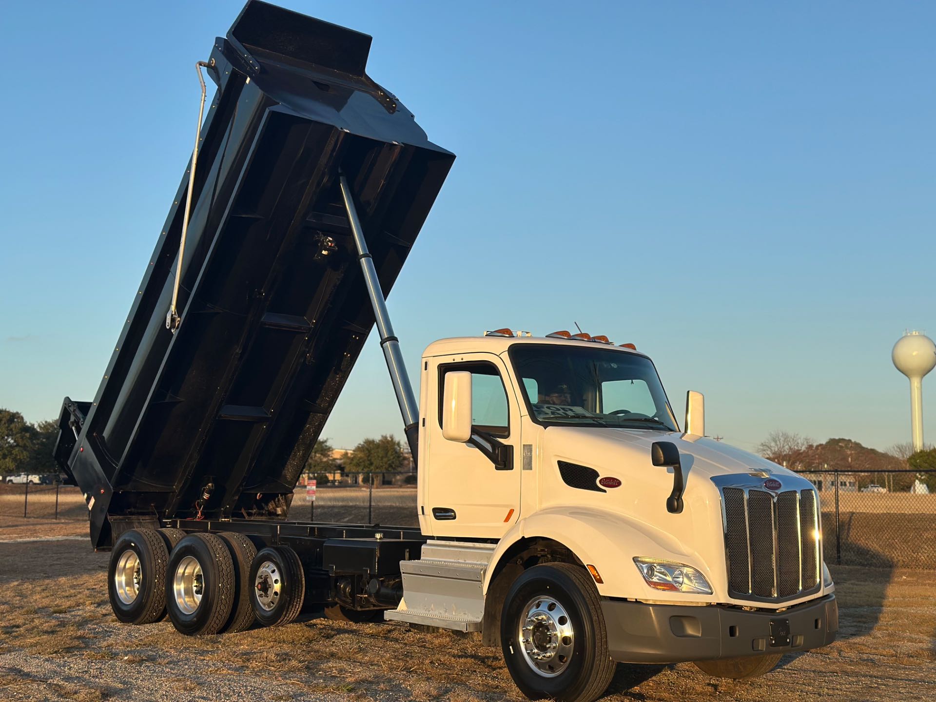 2022 Peterbilt 579 8x4 Tri- Axle Dump Truck 18' Dump Bed w/tarp system