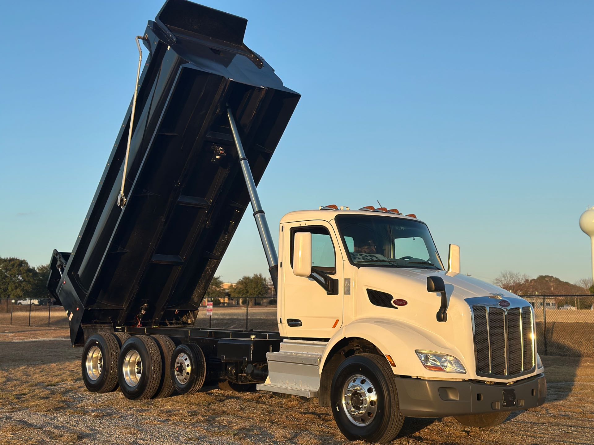 2022 Peterbilt 579 8x4 Tri- Axle Dump Truck 18' Dump Bed w/tarp system