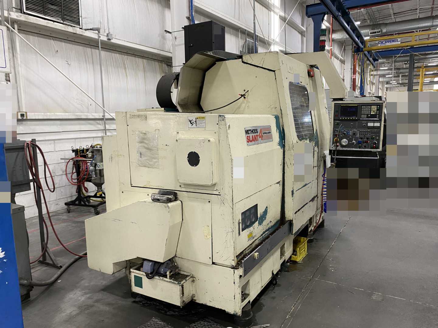 Nakamura-Tome Slant-4B CNC Horizontal Turning Center Fanuc 11T/15-T, 1992, 12" Chuck, 33.86" Swing, 20.47" Over Saddle, 18.31" Turn Dia, 63.38" Z-Travel, 10-Station Turret